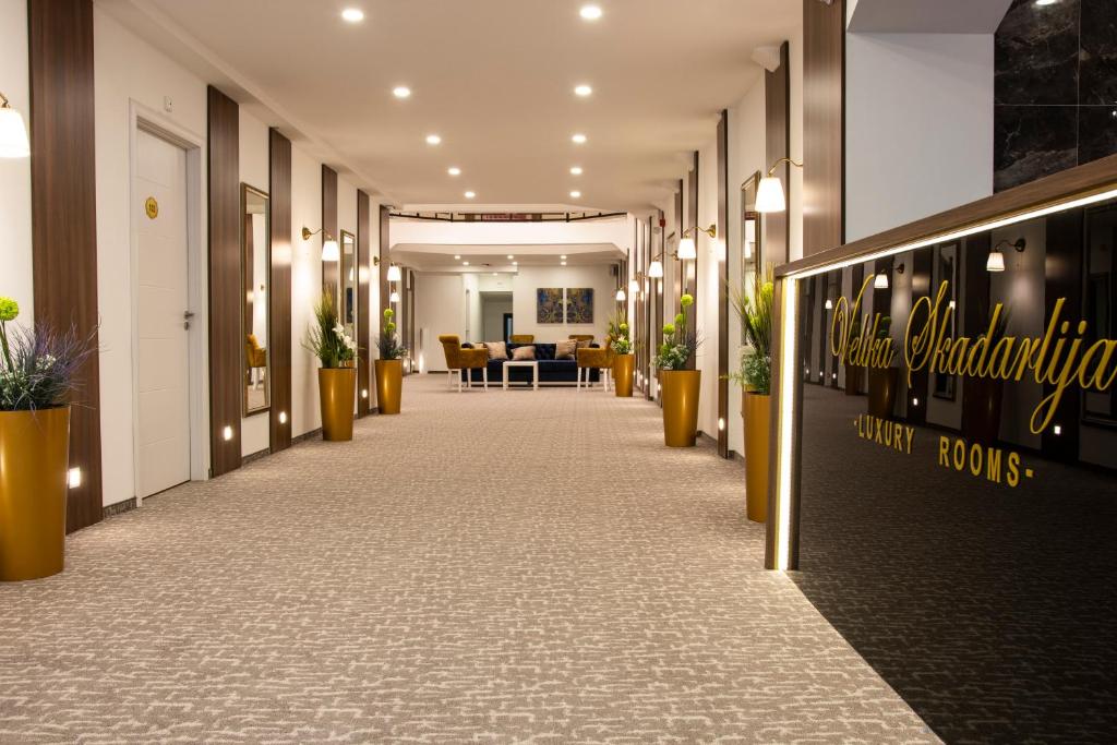 an office corridor with potted plants in a hallway at Luxury Rooms Skadarlija in Belgrade