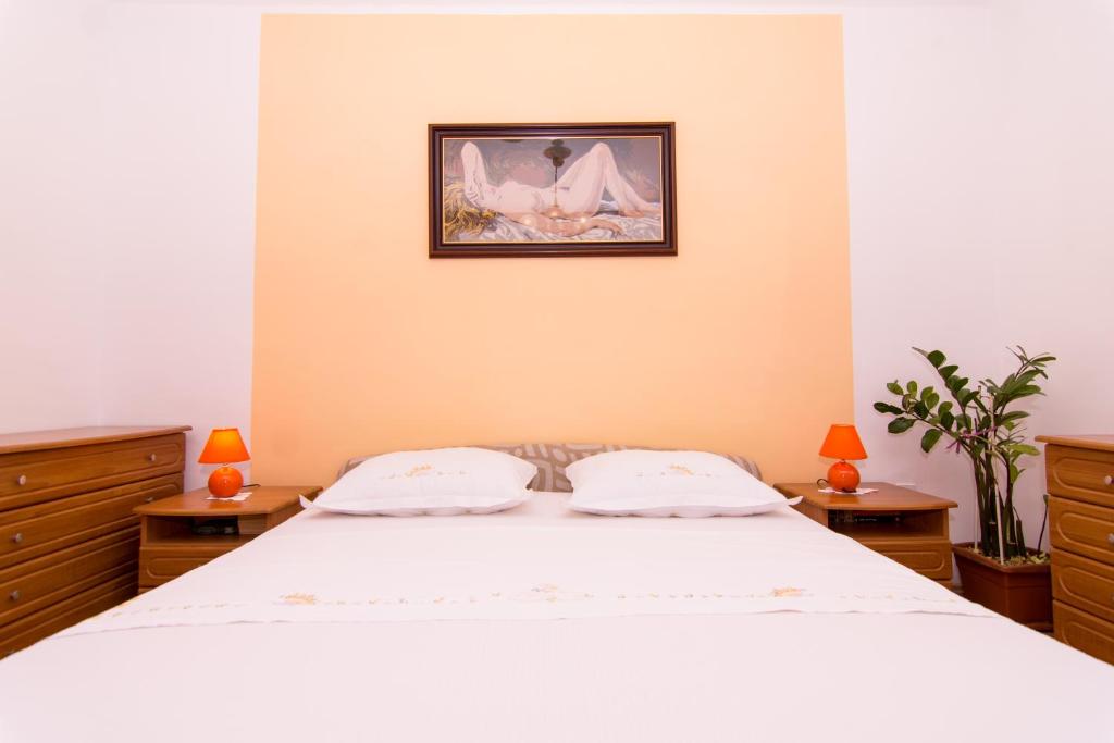 Posteľ alebo postele v izbe v ubytovaní Apartmani MM