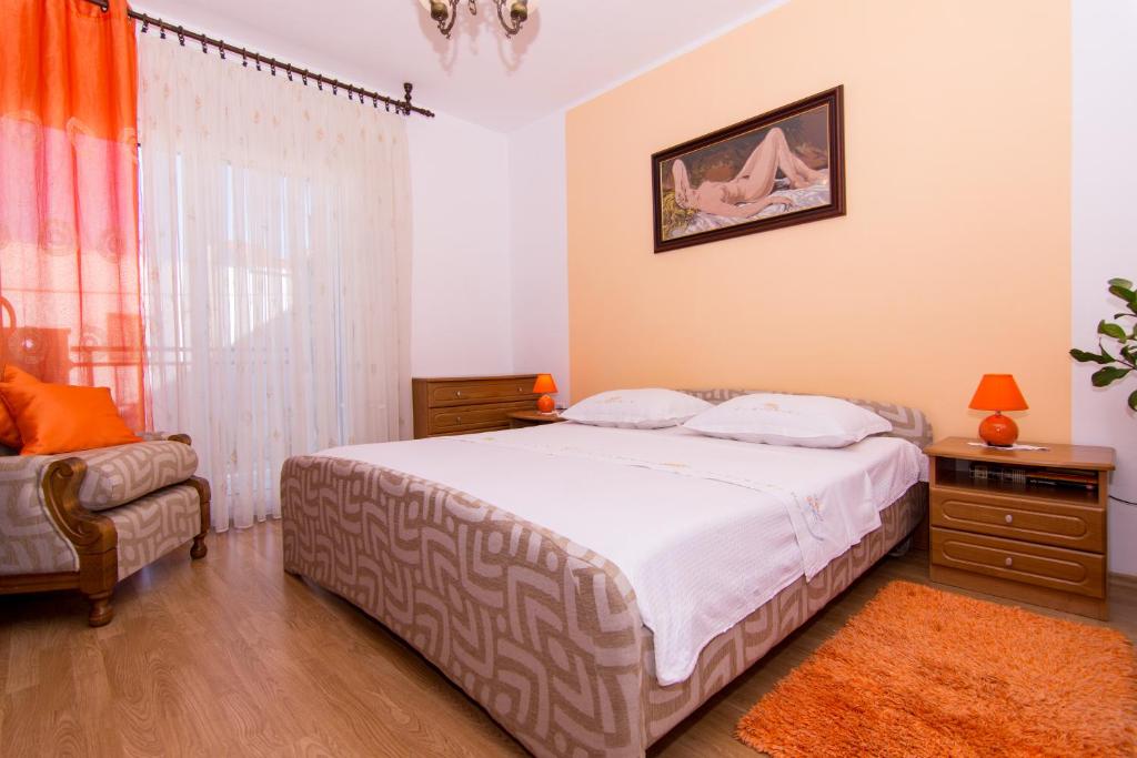 Posteľ alebo postele v izbe v ubytovaní Apartmani MM