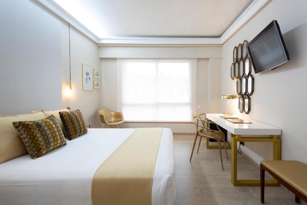 Postel nebo postele na pokoji v ubytování Hotel Ciudad de Vigo