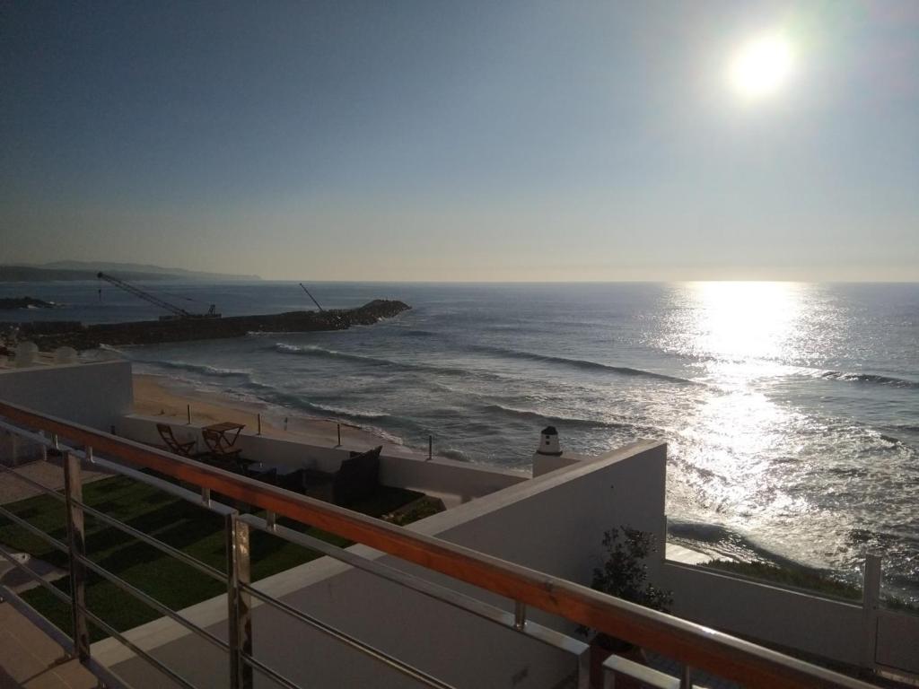 a view of the ocean from the balcony of a house at Ribalta Beach Houses in Ericeira