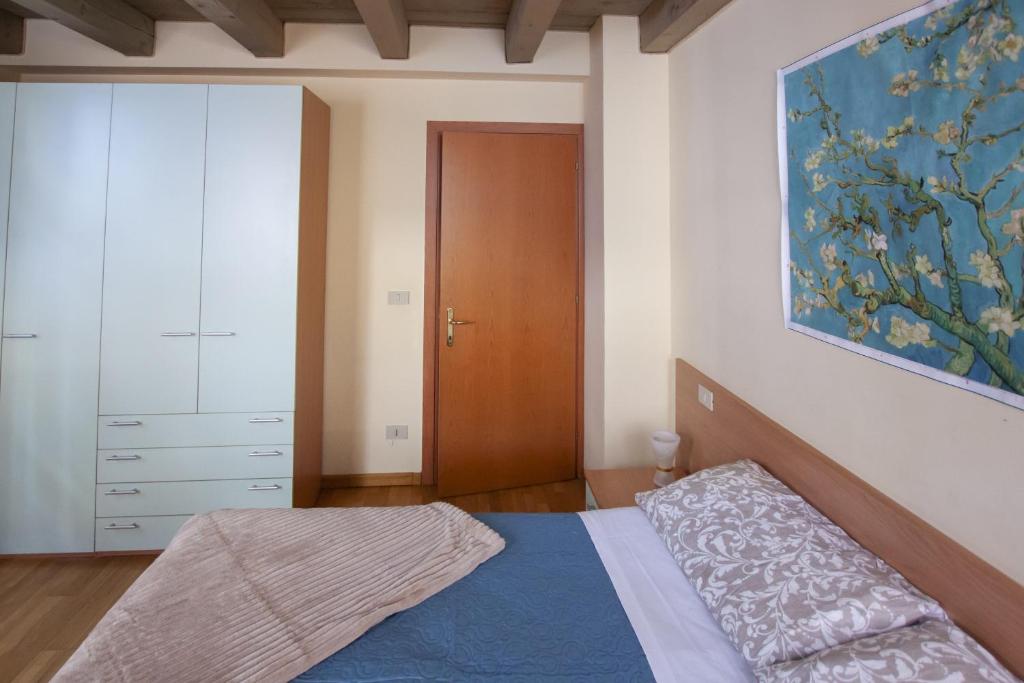 Łóżko lub łóżka w pokoju w obiekcie Venice Apartment