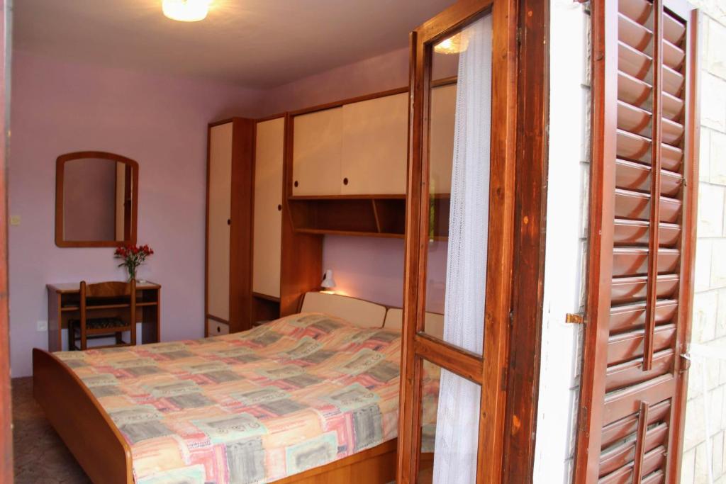 Postel nebo postele na pokoji v ubytování Antun Mozara Family House