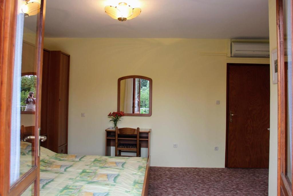 Postel nebo postele na pokoji v ubytování Antun Mozara Family House