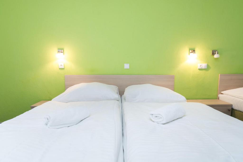 Postel nebo postele na pokoji v ubytování Hotel Na Kocandě