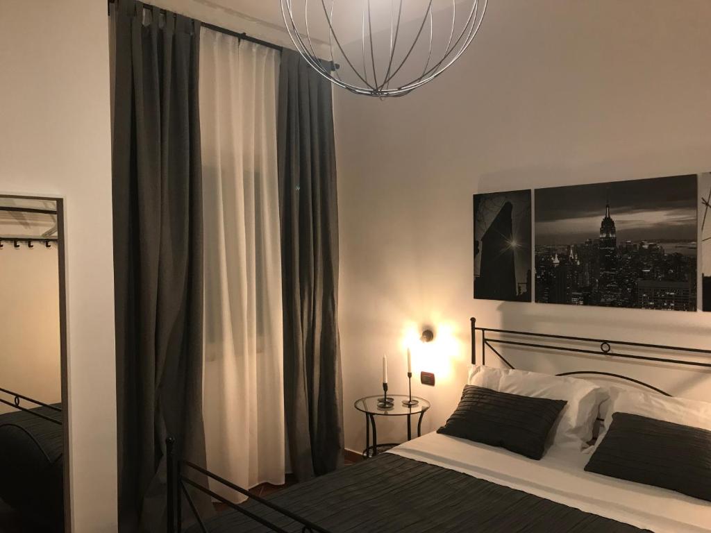 Postel nebo postele na pokoji v ubytování Holiday Rooms Portale Pirrera