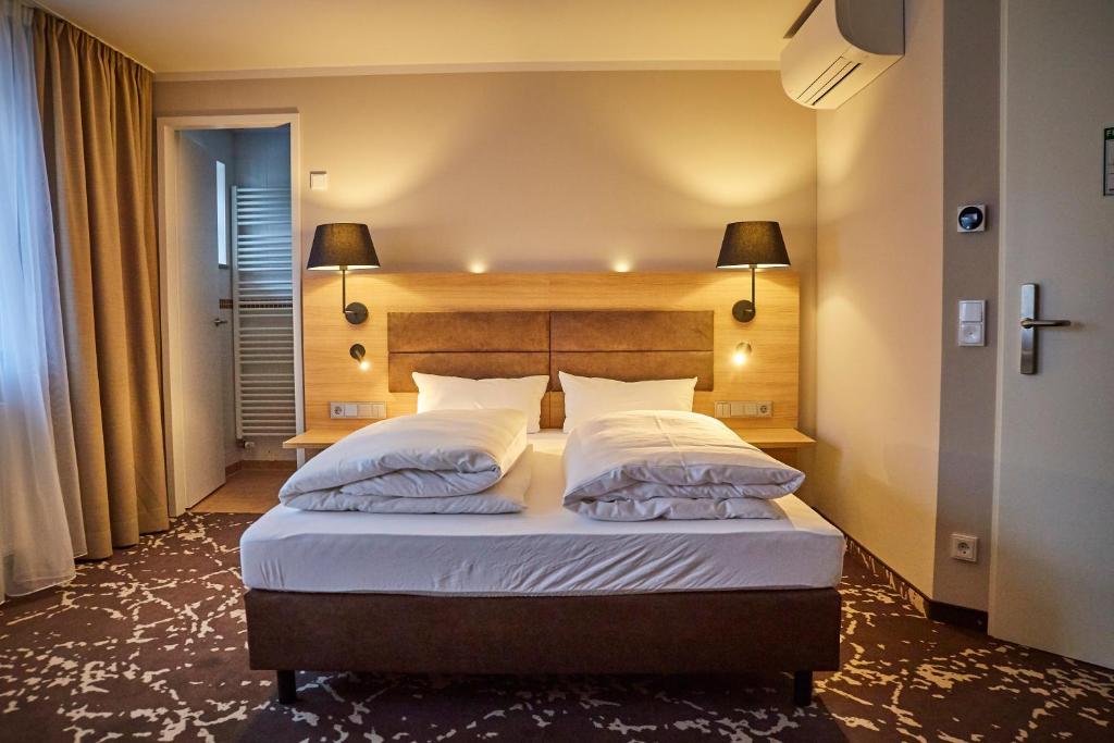 Postel nebo postele na pokoji v ubytování Bed&Breakfast Erber