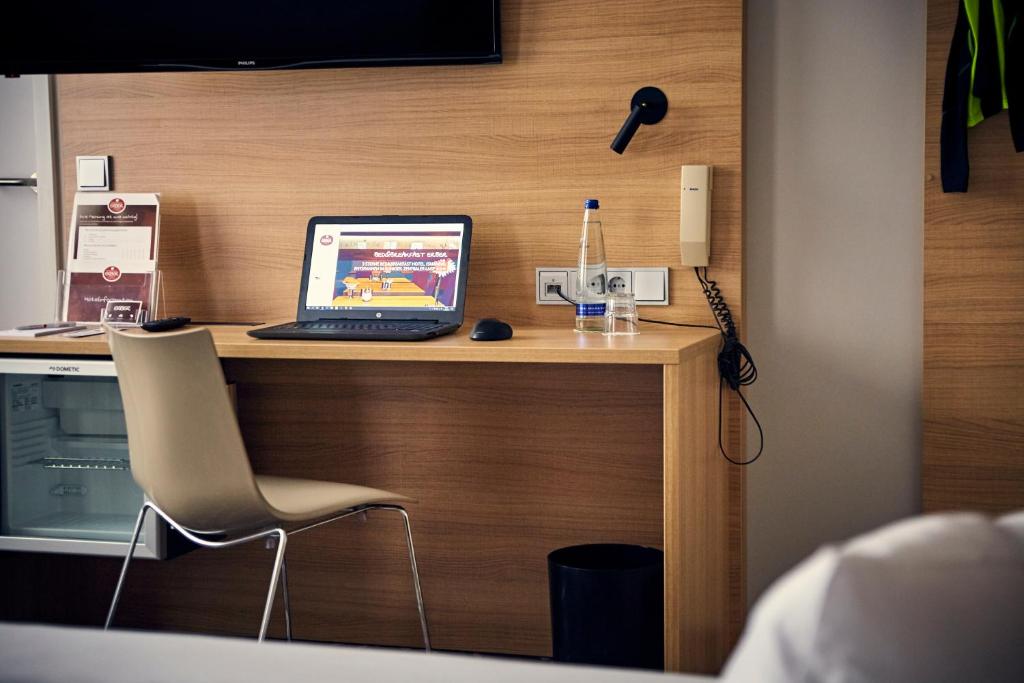 TV a/nebo společenská místnost v ubytování Bed&Breakfast Erber
