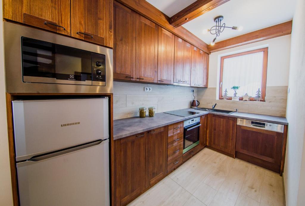 Kuchyň nebo kuchyňský kout v ubytování Apartmány Bílá 188