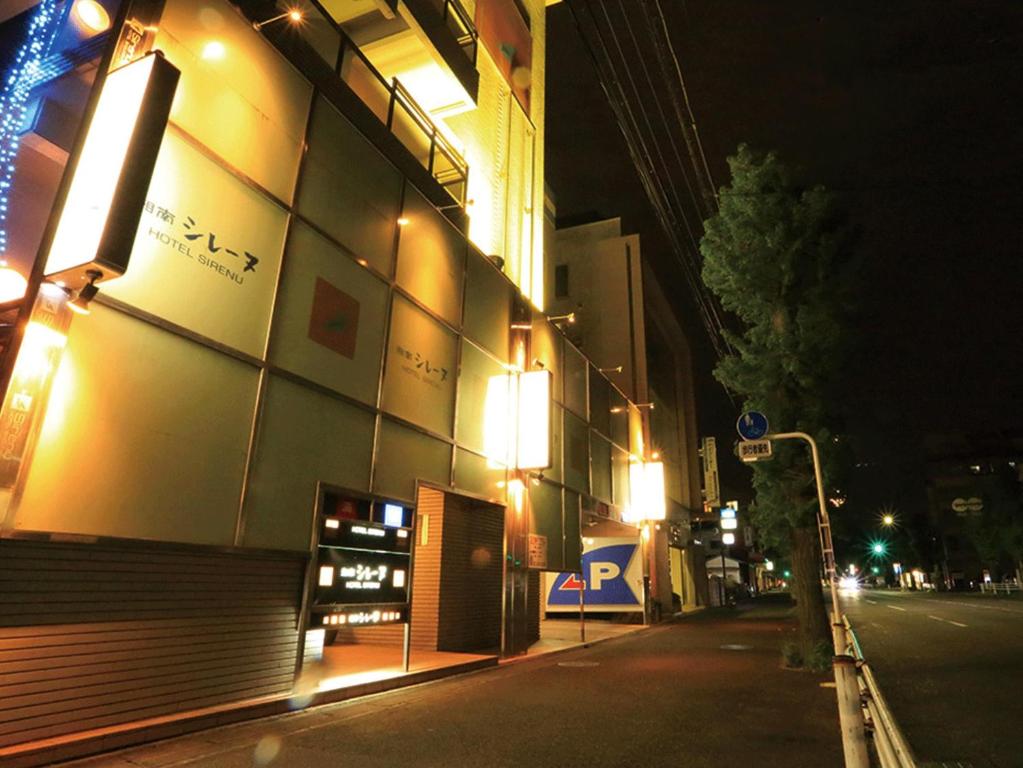 a building with lights on the side of a street at Shonan Sirene (Adult Only) in Hiratsuka