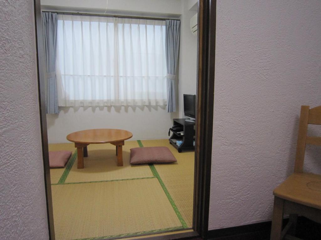 Postel nebo postele na pokoji v ubytování Pension Kitashirakawa