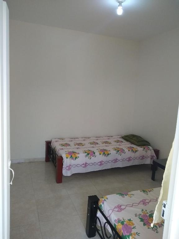 Postel nebo postele na pokoji v ubytování Hotel Maxim