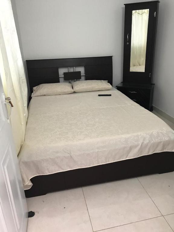 Postel nebo postele na pokoji v ubytování Hotel Maxim