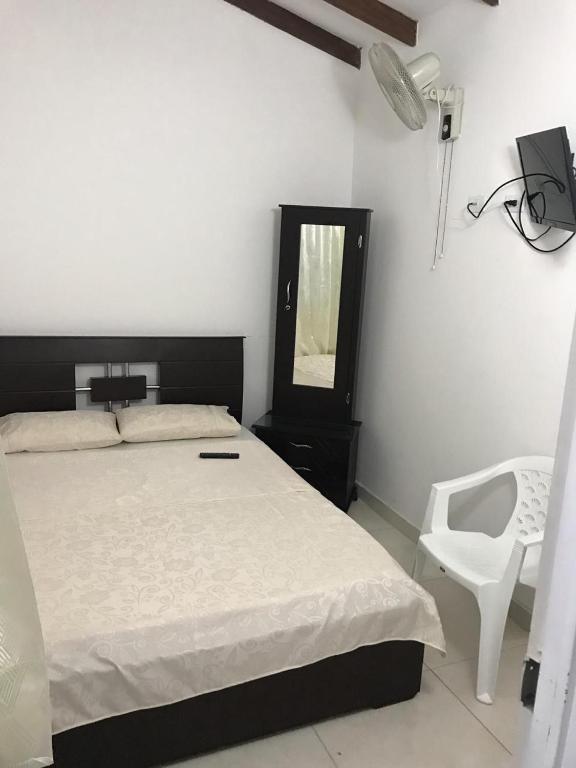 Postel nebo postele na pokoji v ubytování Hotel Maxim