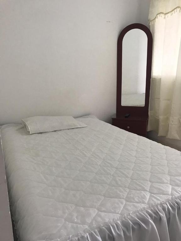 Postel nebo postele na pokoji v ubytování Hotel Maxim