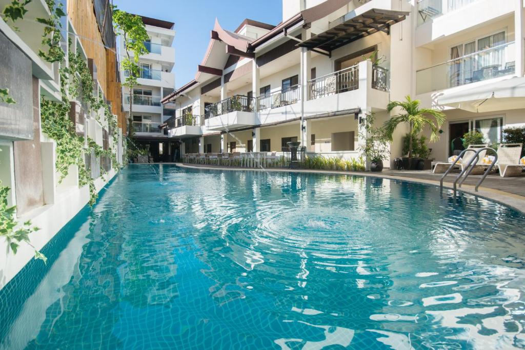 a swimming pool in the middle of a building at Boracay Haven Resort in Boracay