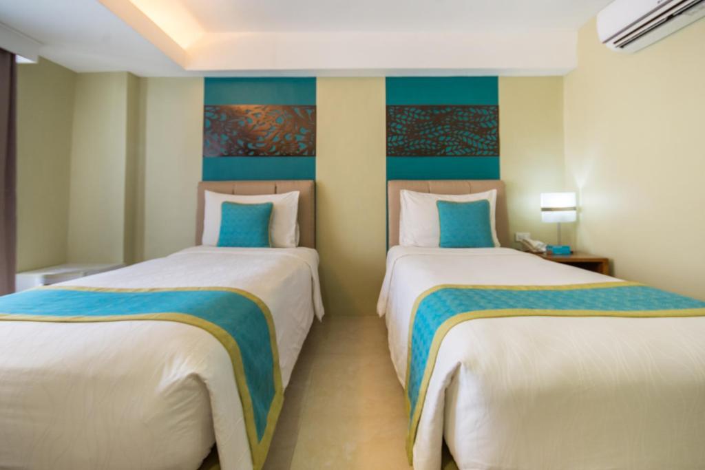 Postel nebo postele na pokoji v ubytování Boracay Haven Resort