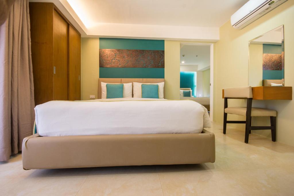 Postel nebo postele na pokoji v ubytování Boracay Haven Resort