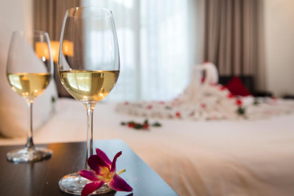 Postel nebo postele na pokoji v ubytování Edele Hotel Nha Trang Beach