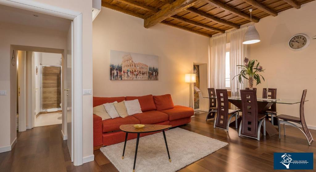 a living room with a couch and a table at L'Olimpo di Estia in Rome