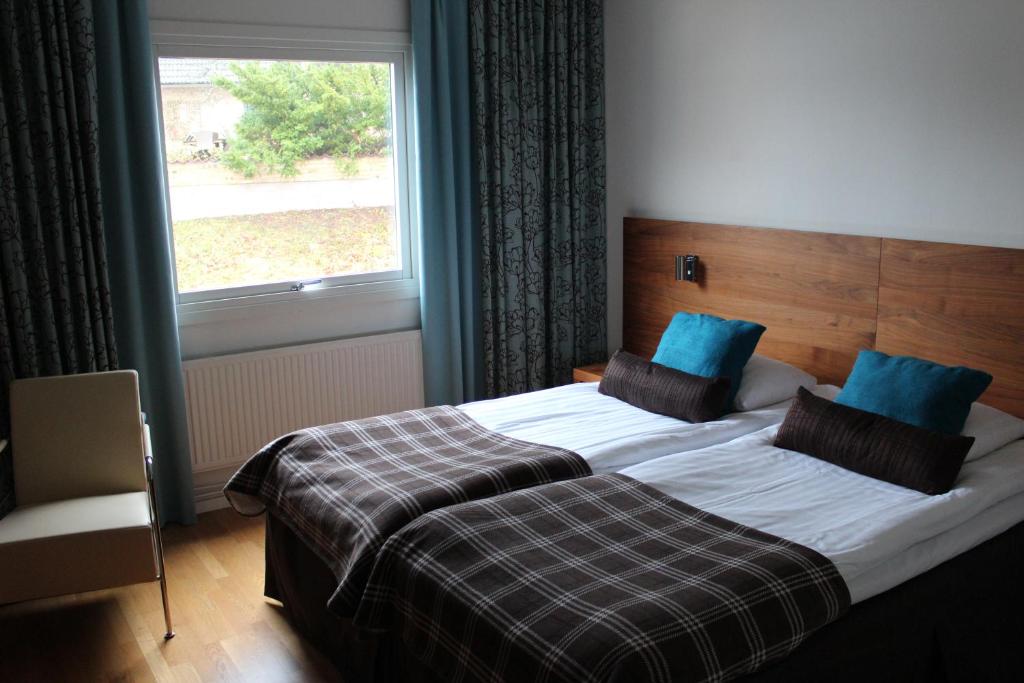 Postel nebo postele na pokoji v ubytování Hotell Åsen