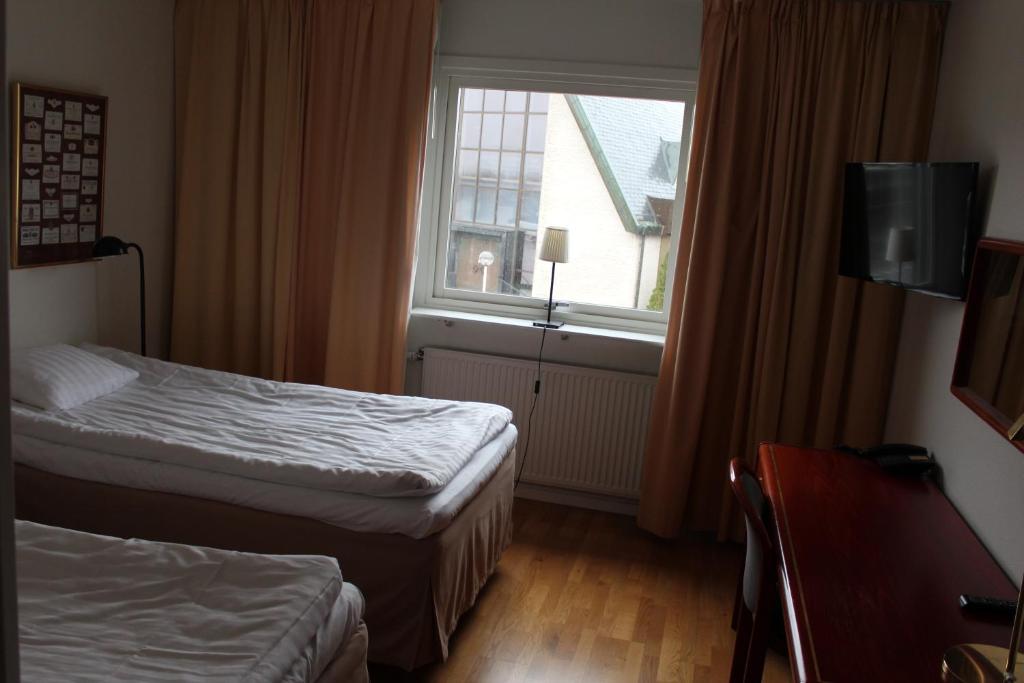 Postel nebo postele na pokoji v ubytování Hotell Åsen