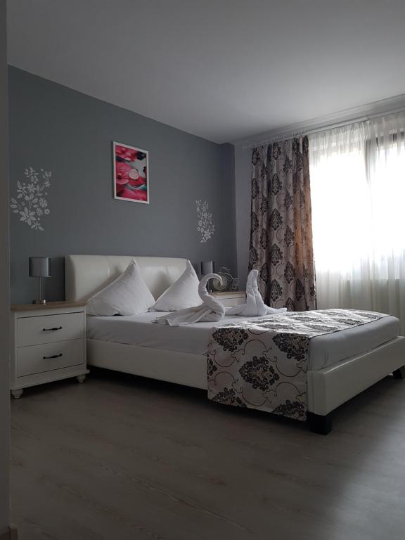 Postel nebo postele na pokoji v ubytování Hotel Dacor