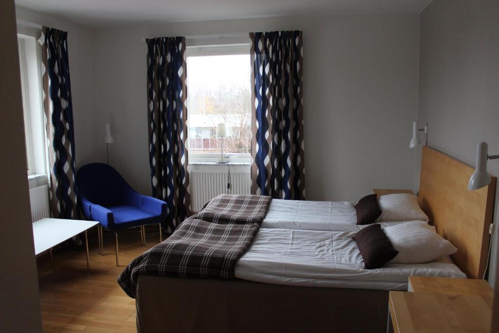 Postel nebo postele na pokoji v ubytování Hotell Åsen