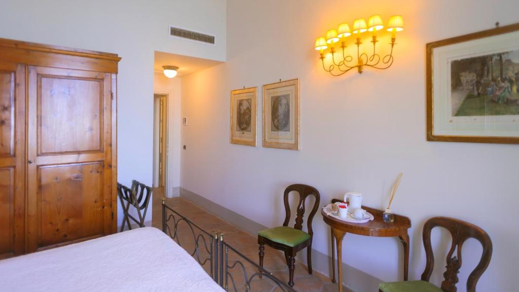 Кровать или кровати в номере Hotel Villa Ottone