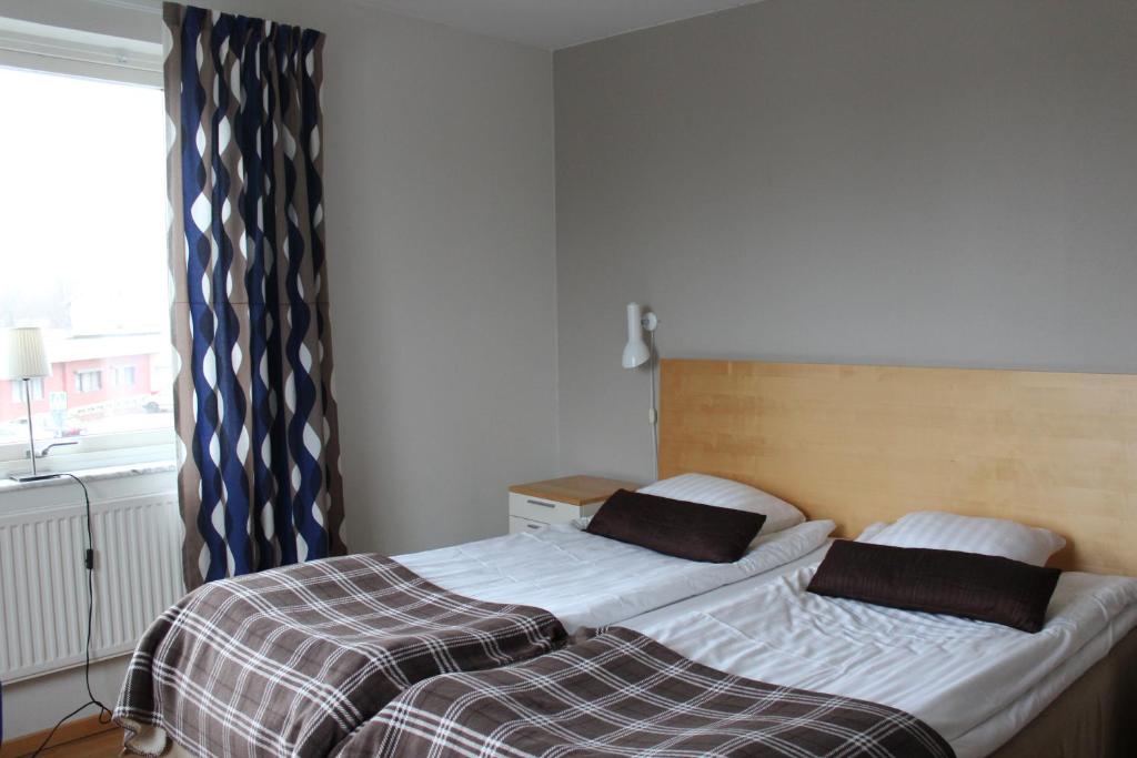 Postel nebo postele na pokoji v ubytování Hotell Åsen