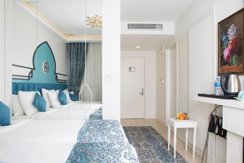 a hotel room with a blue and white at KRALICE HOTEL in Istanbul
