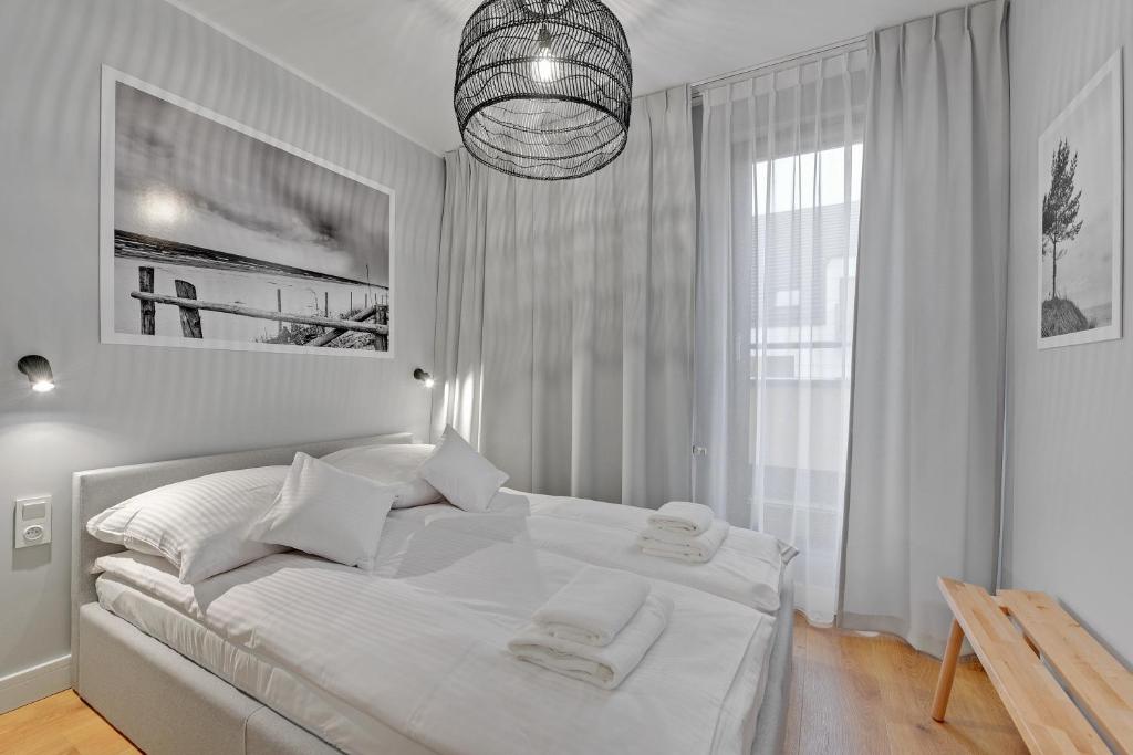 Posteľ alebo postele v izbe v ubytovaní Aura Island Riverside by Downtown Apartments