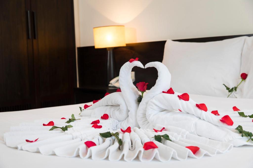 Postel nebo postele na pokoji v ubytování Edele Hotel Nha Trang Beach