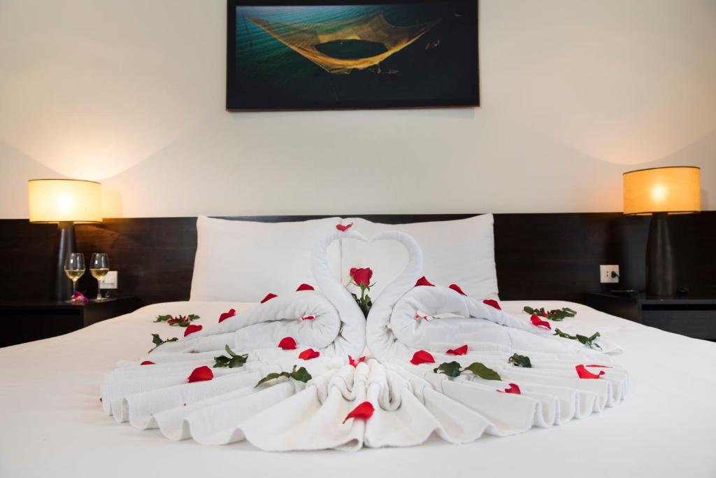 Postel nebo postele na pokoji v ubytování Edele Hotel Nha Trang Beach