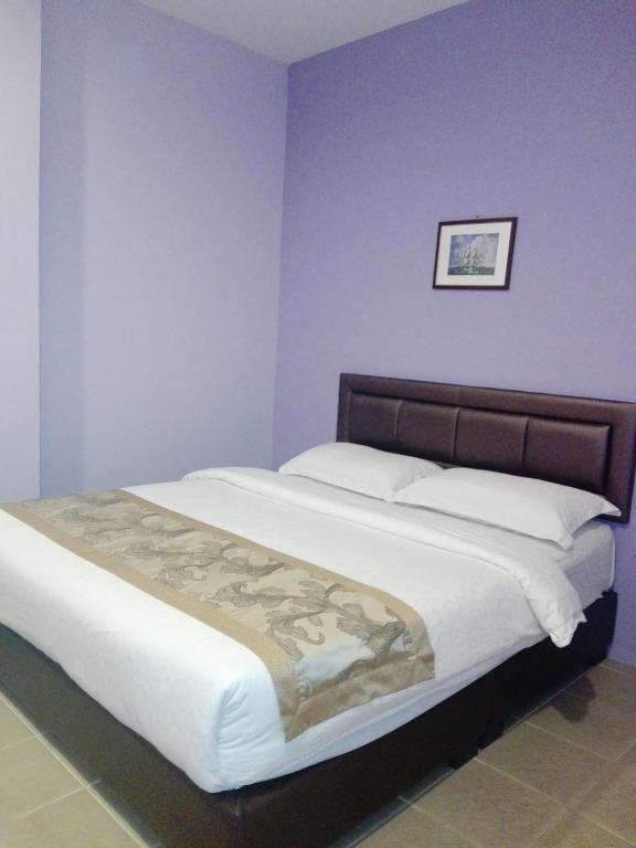 Postel nebo postele na pokoji v ubytování TIONG HUA HOTEL