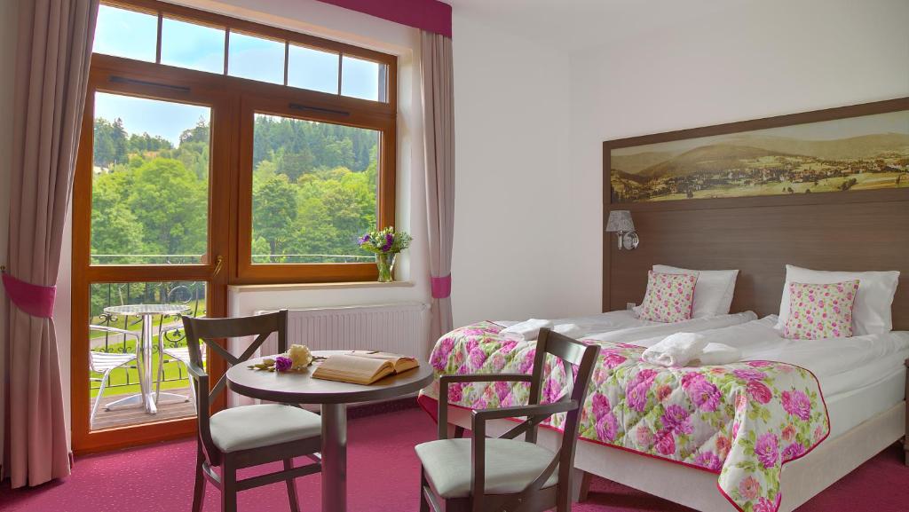 Posteľ alebo postele v izbe v ubytovaní Hotel Buczyński Medical & SPA