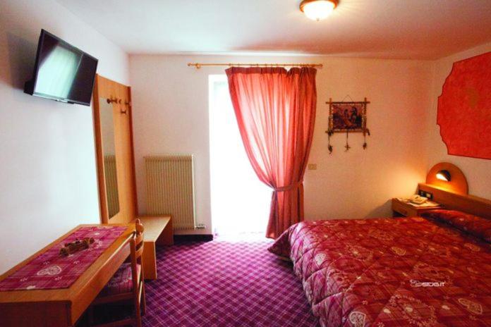 Postel nebo postele na pokoji v ubytování Hotel Ristorante Milano