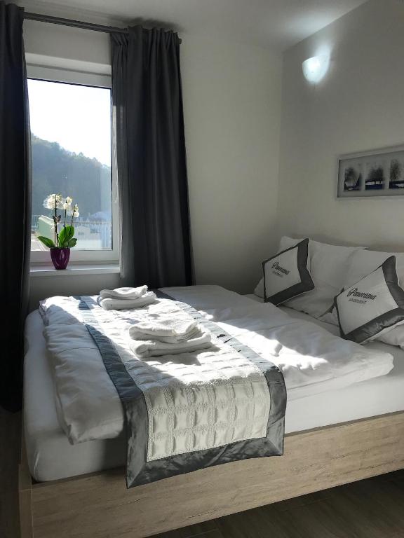 Postel nebo postele na pokoji v ubytování Panorama Apartments