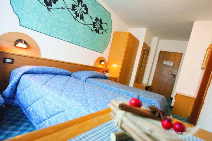 Postel nebo postele na pokoji v ubytování Hotel Ristorante Milano