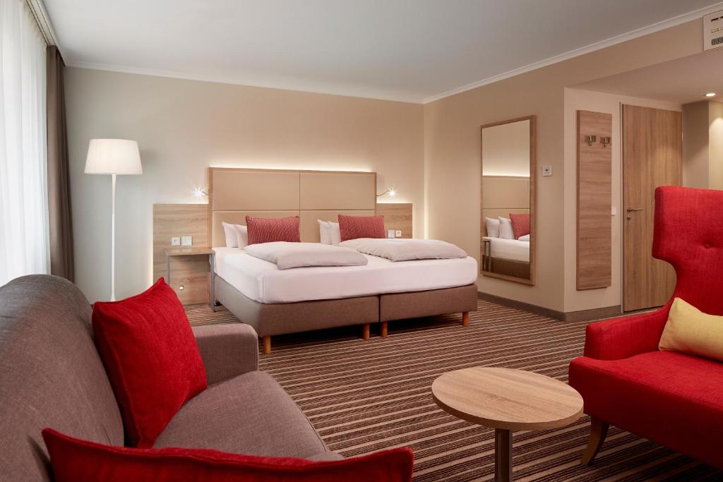 Postel nebo postele na pokoji v ubytování HYPERION Hotel Berlin