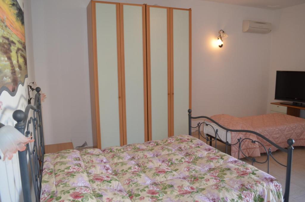 Postel nebo postele na pokoji v ubytování Al Pasarat