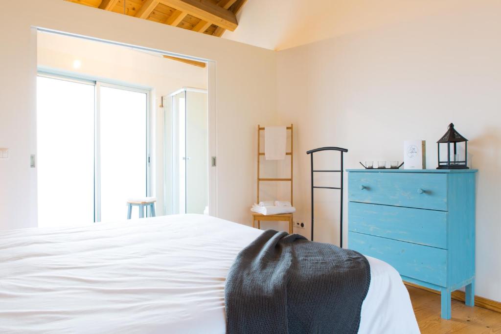 Postel nebo postele na pokoji v ubytování Casa dos Caldeiras