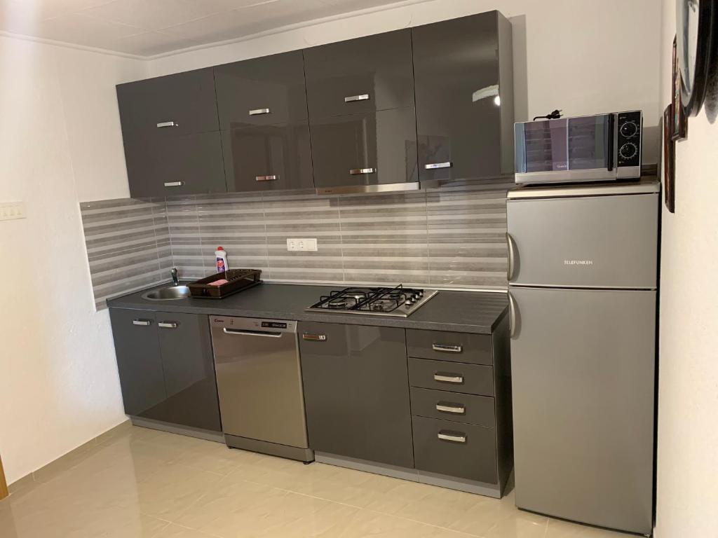 Kuchyňa alebo kuchynka v ubytovaní Apartmani Poljanec