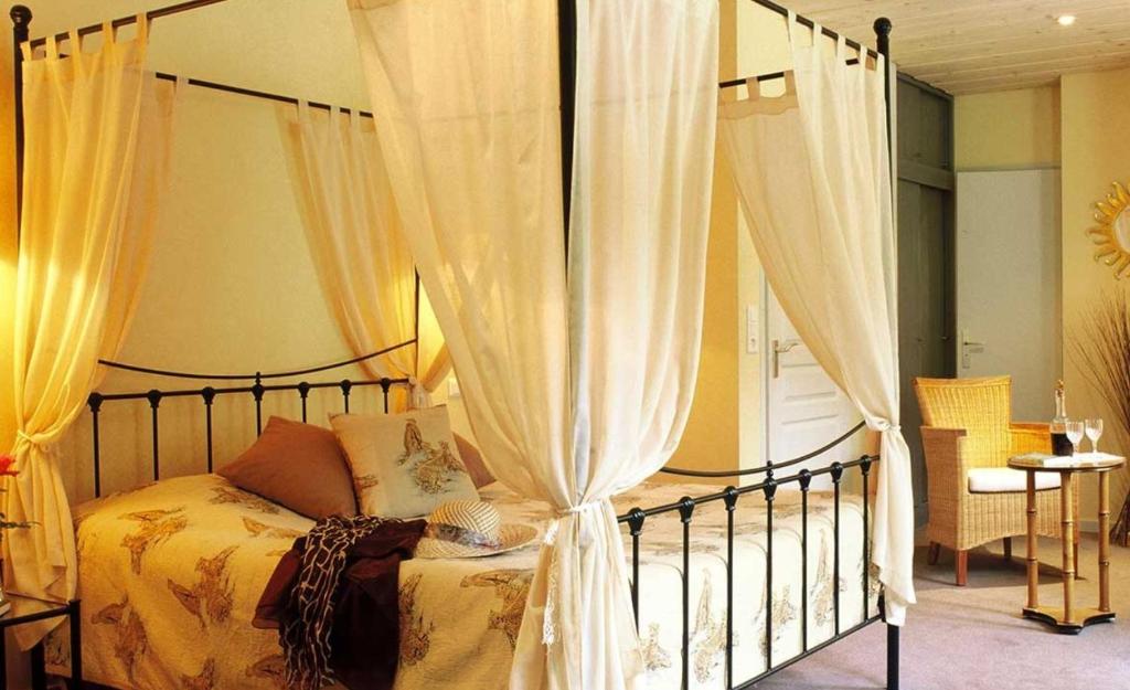 Postel nebo postele na pokoji v ubytování Hôtel Restaurant Taillard