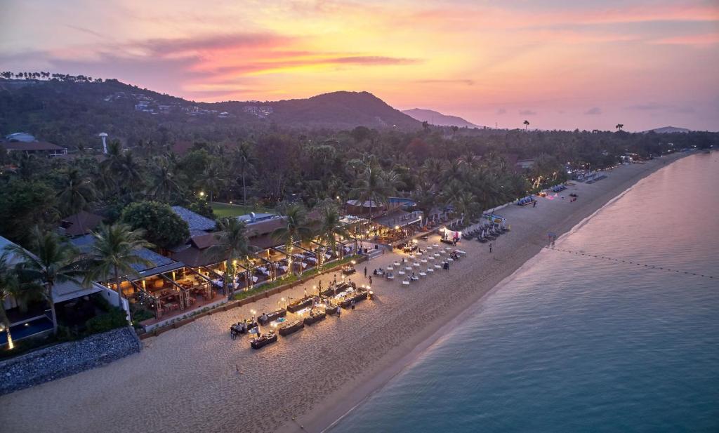 an aerial view of a beach with tables and chairs at Bandara Resort and Spa, Samui in Bophut 
