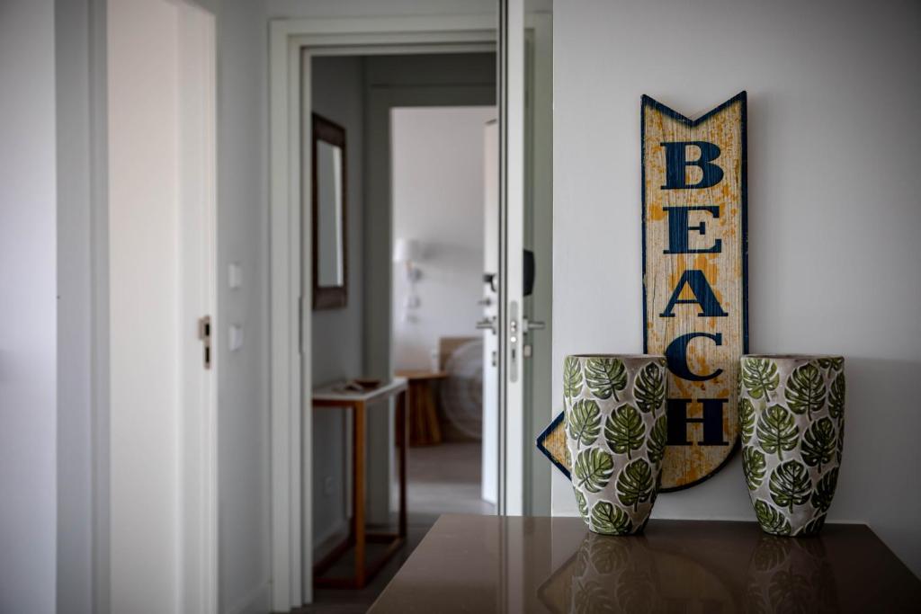 a room with two vases sitting on a table at Pestana Troia Eco-Resort & Residences in Troia