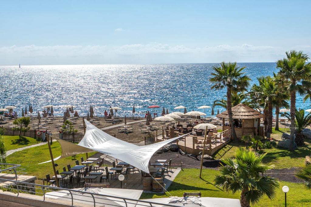 a view of the ocean from a resort at Aregai Marina Hotel & Residence in Santo Stefano al Mare