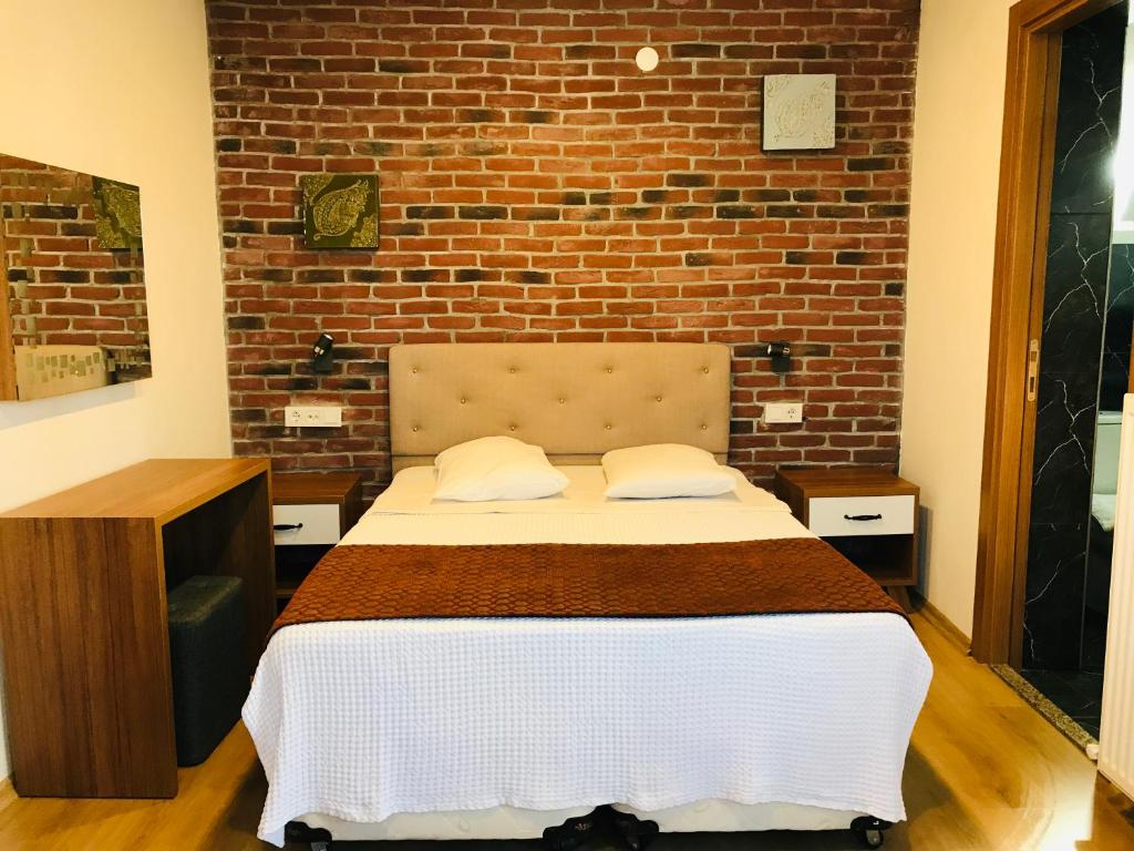 Postel nebo postele na pokoji v ubytování Masal Hotel