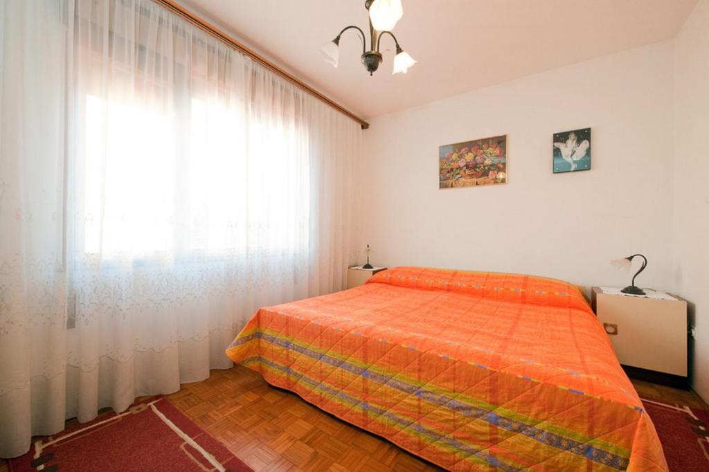 Postel nebo postele na pokoji v ubytování Apartment Patricia