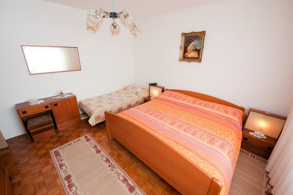 Postel nebo postele na pokoji v ubytování Apartment Patricia
